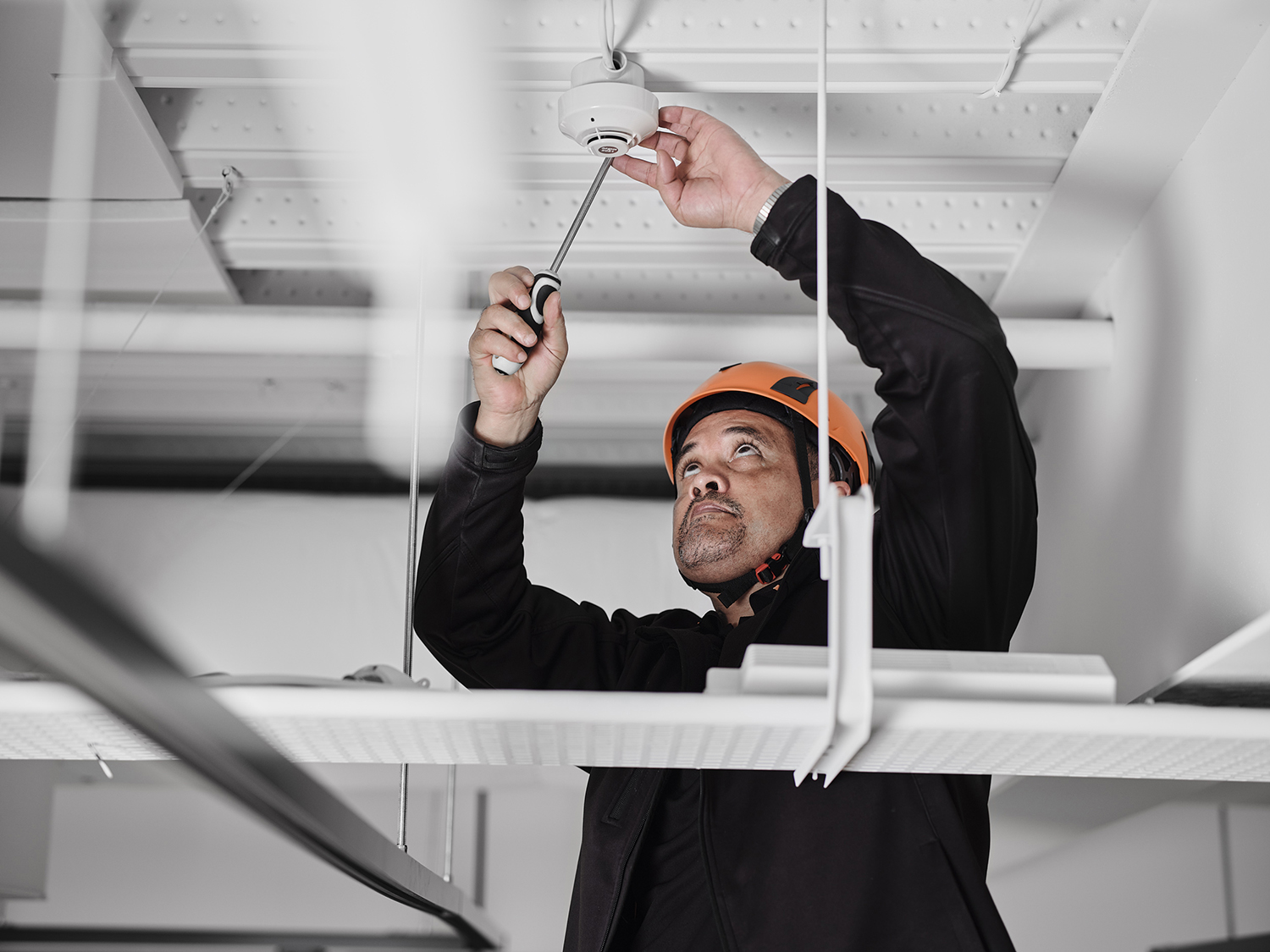 Argus Fire Protection Staff, Installing Fire Alarm System on Ceiling